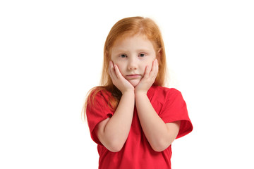 Portrait of sad grey-eyed little girl with hands near her face isolated on white background