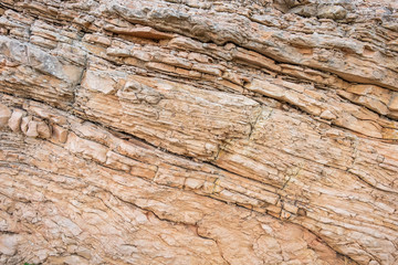 The close-up relief of the rocks texture with layers.