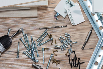 Installation of chipboard furniture in a carpentry workshop. Accessories and tools for carpenters