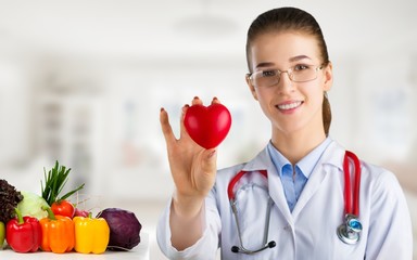 Medical doctor woman over Diet and health care background