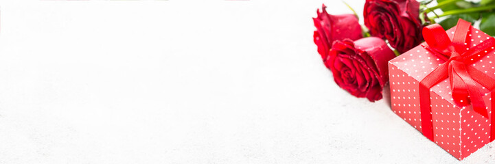 Red roses flower and present box on white. 