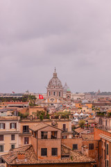 Fototapeta na wymiar View of roofs and churches domes in Rome from Pincio hill, Italy