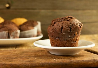 Chocolate cake and nut cake, homemade cakes on wooden background