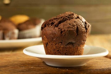 Chocolate cake and nut cake, homemade cakes on wooden background