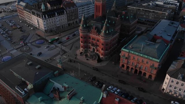 Aerial view of central Helsingborg, Sweden at sunset. Moving forwards over stor torget towards r&radic;&bull;dhuset.
