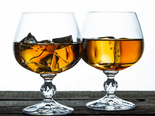 glasses for brandy close-up on an old wooden background
