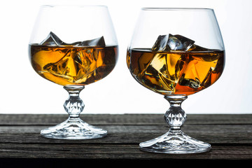 glasses for brandy close-up on an old wooden background
