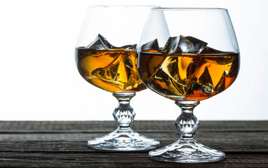 glasses for brandy close-up on an old wooden background