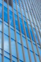 Obraz premium Abstract Building Background against sky and clouds.
