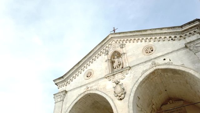 Entrance to the cave, blue sky, Sunday mass