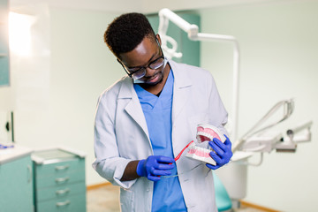 Happy, Affordable, Afro-American Dentist in a Modern Clinic