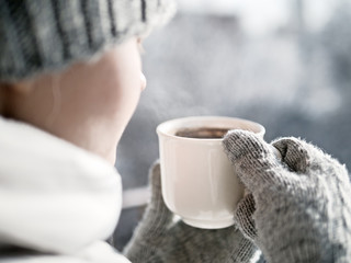 Woman hands holding hot cup coffee, tea