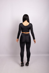 Rear view of sexual sporty woman wearing leggings