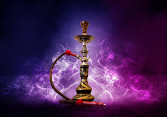 Hookah smoking on a background of abstract futuristic background, neon light, smoke.