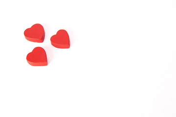 Red wooden hearts on white background. St. Valentine's concept.