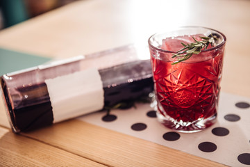 Cold alcoholic cocktail standing near the bottle