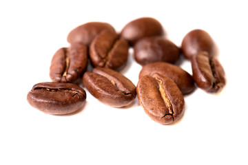 Macro of coffee beans on white background. Selective focus