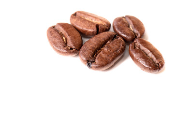 Macro of coffee beans on white background. Selective focus
