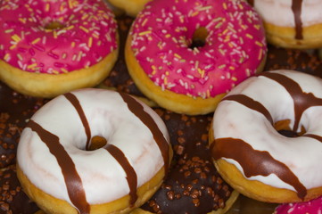 delicious donuts of different flavors, close up