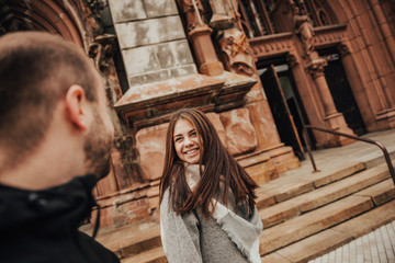 Fototapeta premium Happy lovely girl looks at her boyfriend