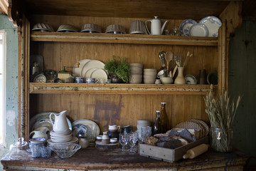 Fototapeta na wymiar Wooden shelves in Norwegian kitchen