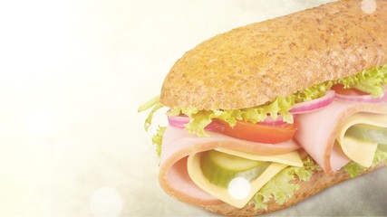 Footlong ham & swiss submarine sandwich isolated on white