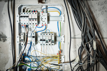 Shield in the wall of the house. wrong connection, automatic distribution, wires are tangled. will...