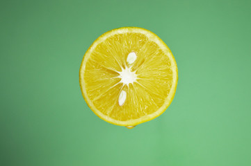 close up of lemon with water drops