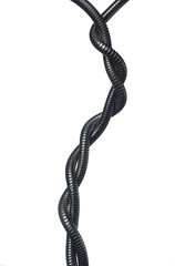 intertwined metal corrugation on white and black background