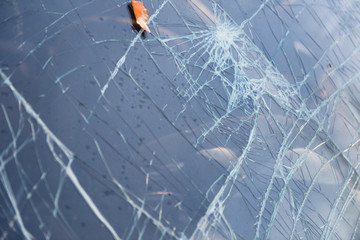 Broken after the accident windshield.