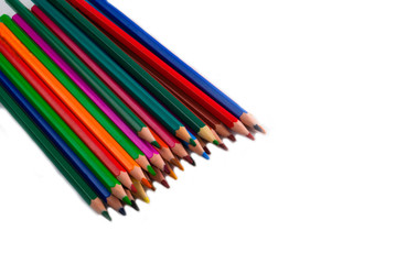 COLORED PENCILS ON A WHITE BACKGROUND