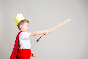 child in knight costume with crown