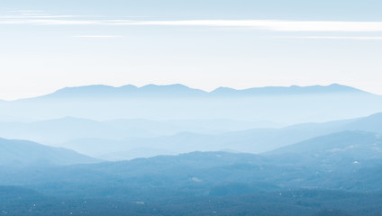 View of Mountains.  Layers of Hills in the haze and clouds.