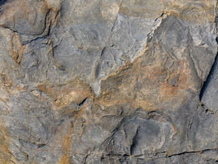 Natural stone or the surface of the stone as a background texture is large..