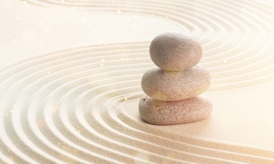 Zen stones in the sand. Beige background