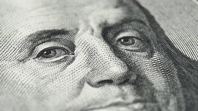 Benjamin Franklin on US 100 dollar bill extreme macro slow rotating. Low angle shot. Stock video footage