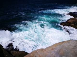 waves crashing on rocks