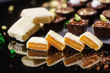 chocolate sweets on the black background