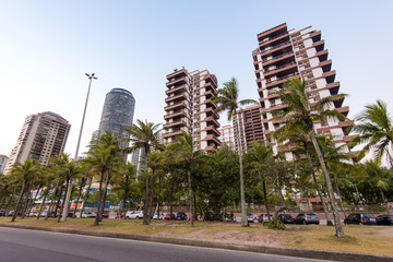 Modern Condominium Buildings Along the Road With Palm Trees