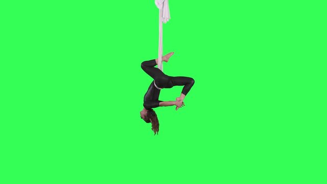 Beautiful Acrobatic Tissue artist performs over a green screen