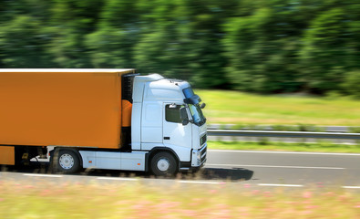 A fast truck running on the highway