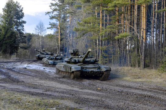 Russian battle tanks on the exercises in the forest area