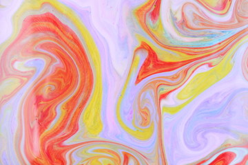 Fluid art from different colors. Multicolored background from paints on liquid. Bright pattern on liquid. Colored paint stains in style of pop art