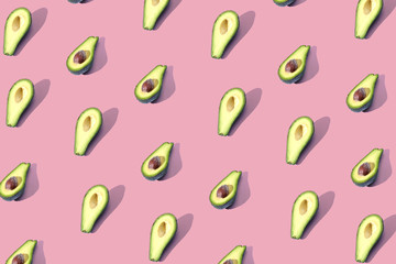 Many halves of avocado, pattern, banner. The procurement of bright background, red coral pastel color.