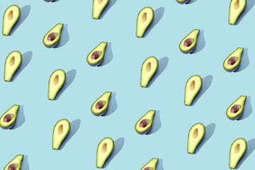 Many halves of avocado, pattern, banner. Blank bright background, blue purple pastel color.