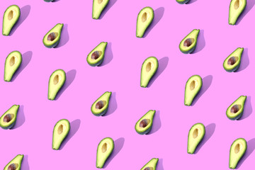 Many halves of avocado, pattern, banner. Billet bright background, pink purple pastel color.