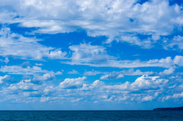 sea landscape is a pebbly beach with waves in white foam