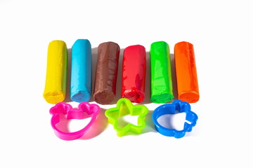 Close up view of multicolored plasticine and molds for modelling . Creative children concept.