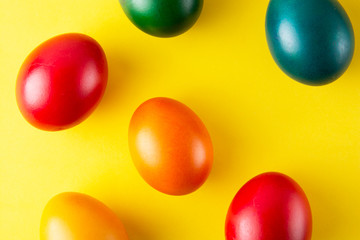 Colorful Easter eggs, easter or spring background with home painted eggs. Top view, copy space. Spring time. Colorful background.