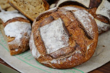 Rustic French sourdough bread boule with slashes on top of the crust